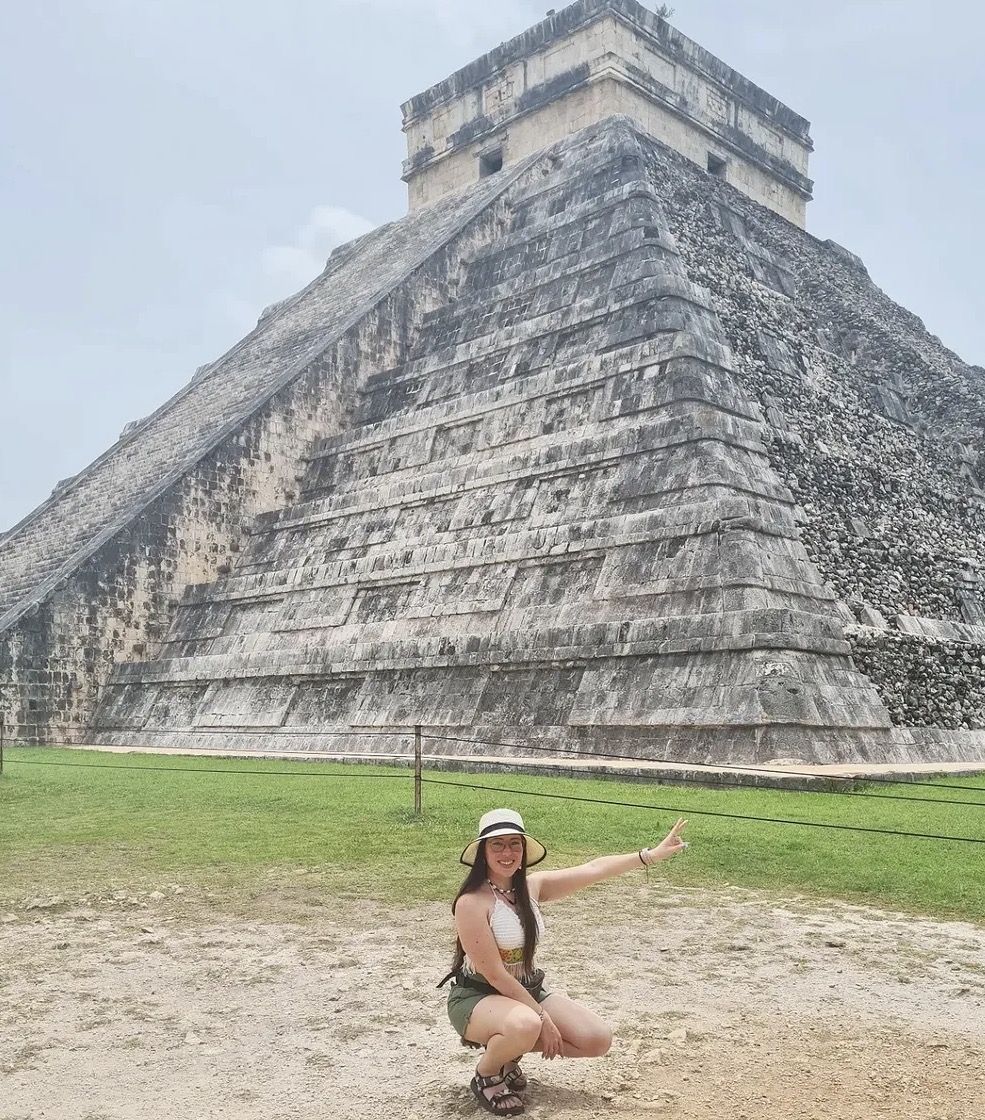 Essential packing items laid out for a Chichen Itza day tour including sunscreen, hat, and water bottle